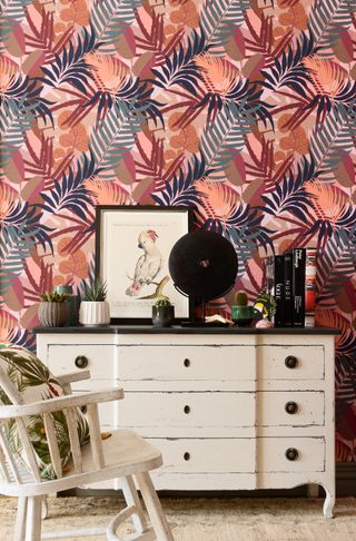 tropical botanical wallpaper in the bedroom by Dowsing & Reynolds