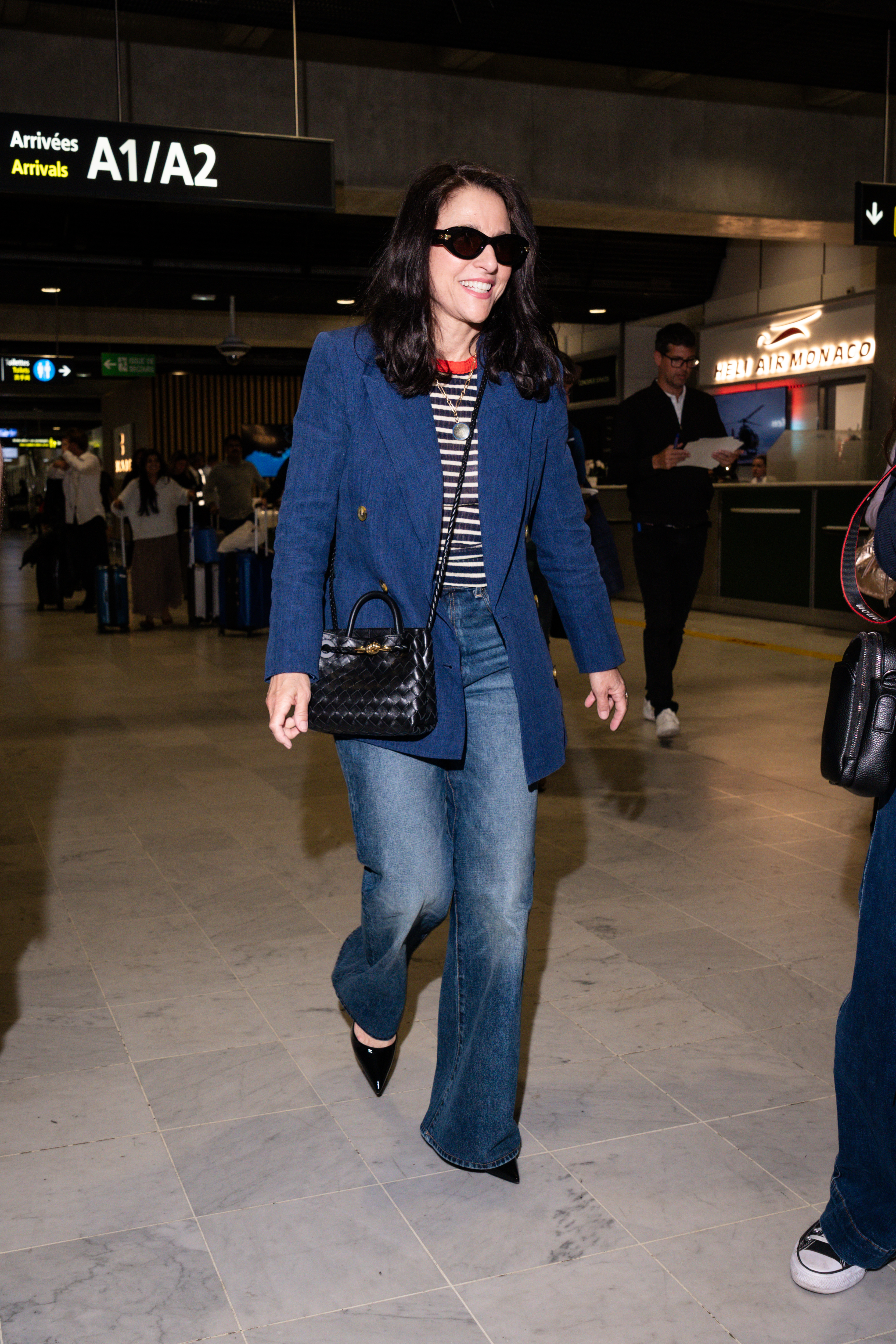 An image of Julia Louis-Dreyfus wearing an over over 50s French fashion trend at the 2026 Cannes Film Festival.