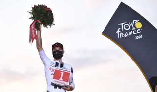 Team Sunweb rider Switzerlands Marc Hirschi celebrates his combativity prize at the end of the 21st and last stage of the 107th edition of the Tour de France cycling race 122 km between ManteslaJolie and Champs Elysees Paris on September 20 2020 Photo by AnneChristine POUJOULAT AFP Photo by ANNECHRISTINE POUJOULATAFP via Getty Images