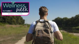 Man hiking with heavy backpack