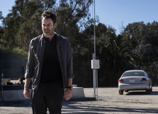Bill Hader as Barry, staring down, while standing near a parked car.