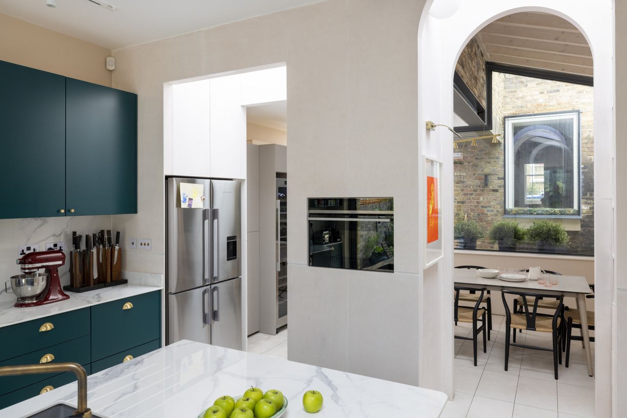 A modern kitchen extension with arches and an interior courtyard
