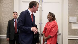 Virginia Republican gubernatorial candidate Glenn Youngkin speaks with Virginia Republican candidate for lieutenant governor Winsome Sears during an election night event at the Westfields Marriott Washington Dulles on Nov. 2, 2021 in Chantilly, Virginia.