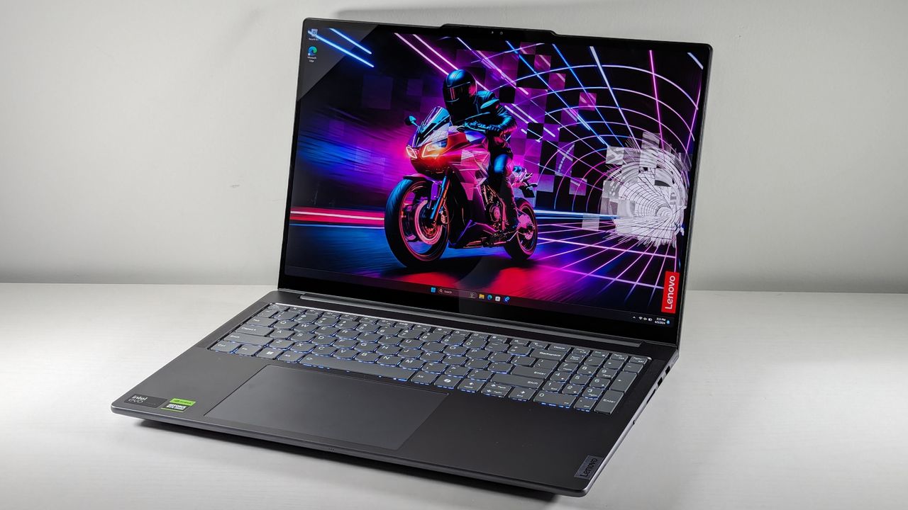 The Lenovo Yoga Pro 9i 16 Gen 9 with lid open on a white table