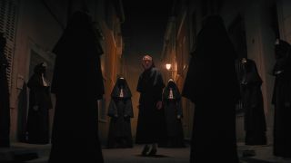 Sister Irene surrounded by nuns in The Nun 2