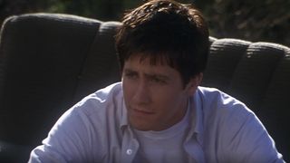 Donnie sitting outside on couch talking to Gretchen in Donnie Darko