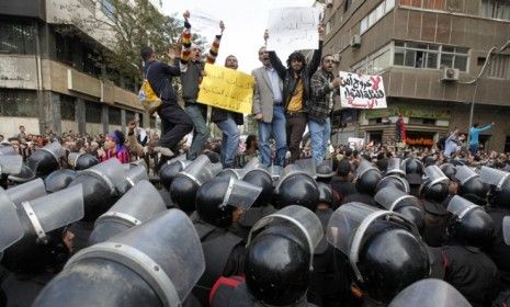 Demonstrators take part in a protest against the newly-elected Islamist party, whose power will be limited by the military, critics say.