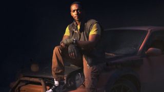 Anthony Mackie as John Doe sitting on a car during the Twisted Metal TV Show