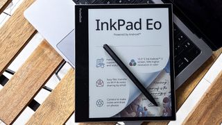 PocketBook InkPad Eo with its stylus on a laptop