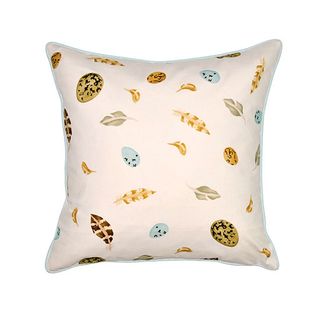 egg feather and polka printed pillow with white background