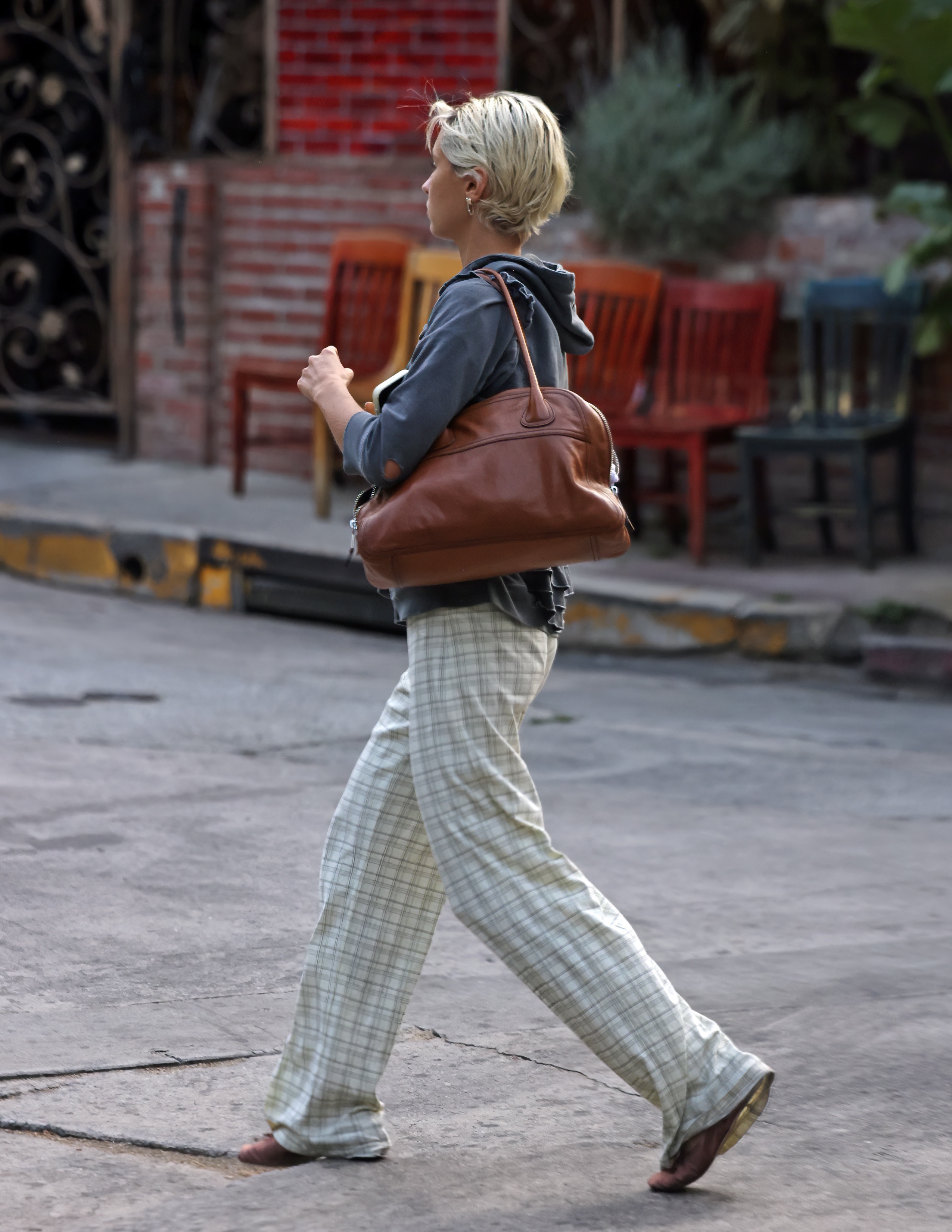 Iris Law wore the Miu Miu Vivant bag with printed pants and ballet flats 6/30/2026