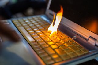 The keyboard of a laptop device having caught fire