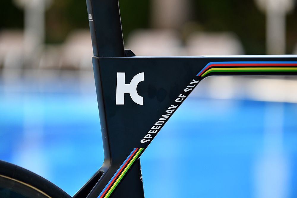 Katusha's logo is prominent on the bike.