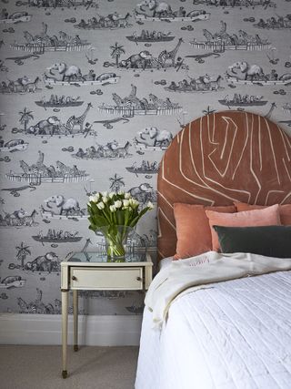boho bedroom ideas with clashing patterned headboard and wallpaper