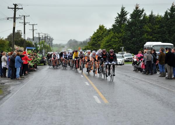 Fans line the course despite the wet weather conditions