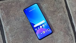 The Realme GT Master Edition facing upwards on the floor.