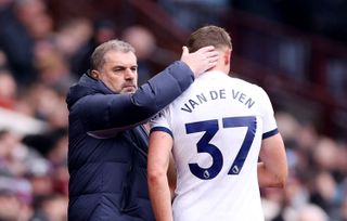 Tottenham defender Micky van de Ven is consoled by manager Ange Postecoglou after coming off injured against Aston Villa in March 2024.
