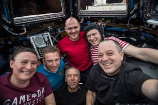 A group photo taken of the full International Space Station crew shortly before three astronauts left earlier this month.