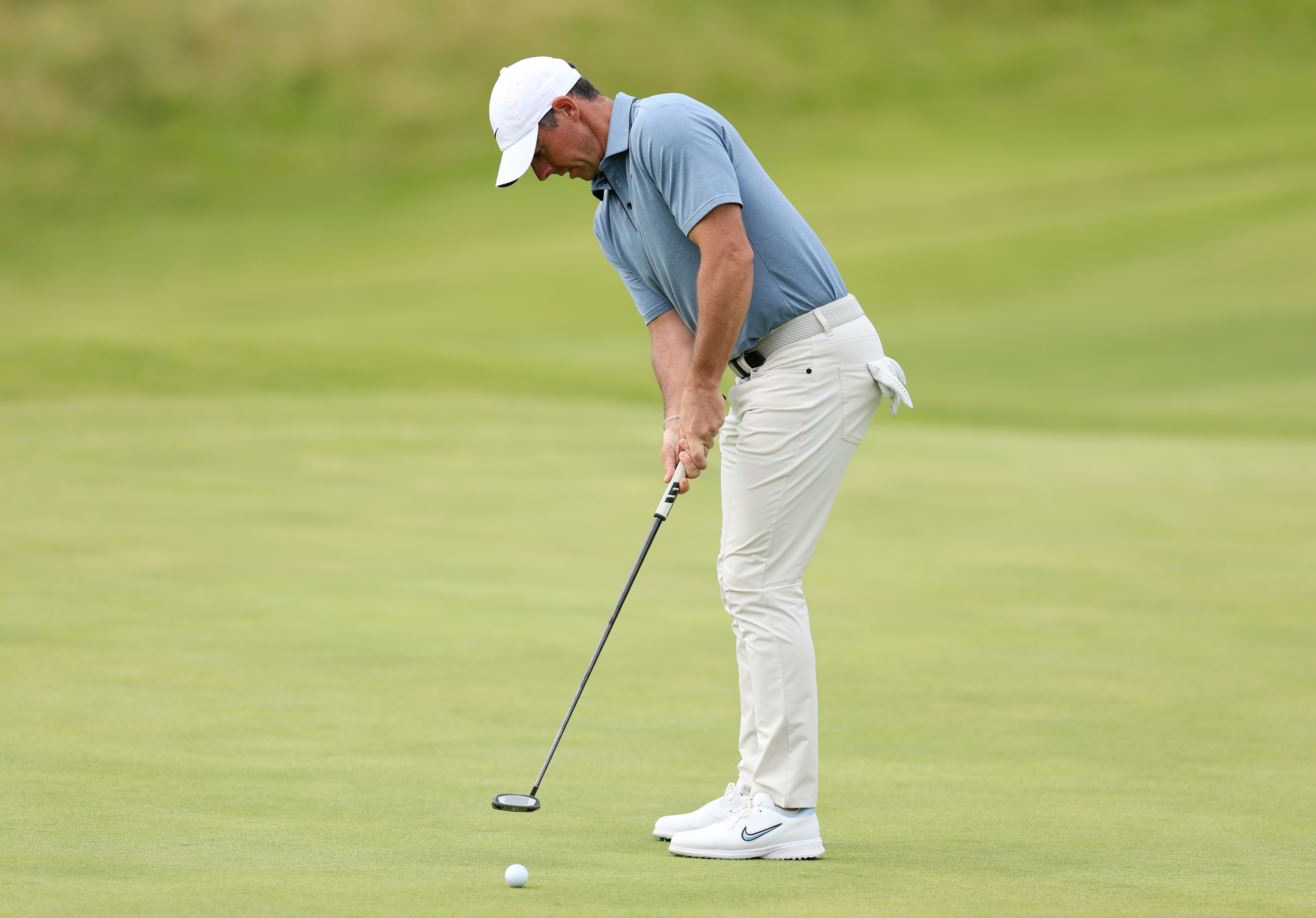Rory McIlroy hits a putt