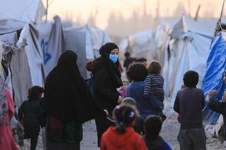 Nabiha Taha with children in displacement camp