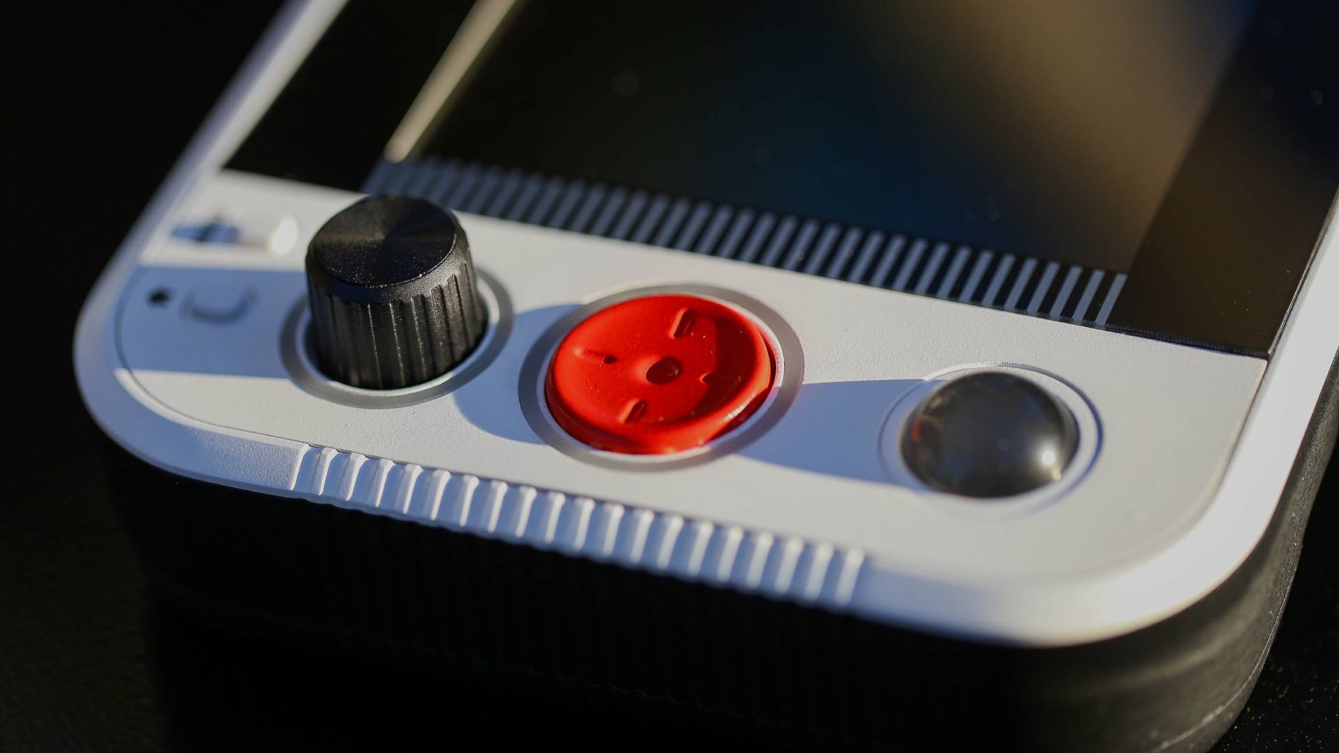 Close up of Atari GameStation Go paddle, D-pad, and trak-ball.