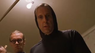 Peter Stormare wearing a black hood in The Big Lebowski