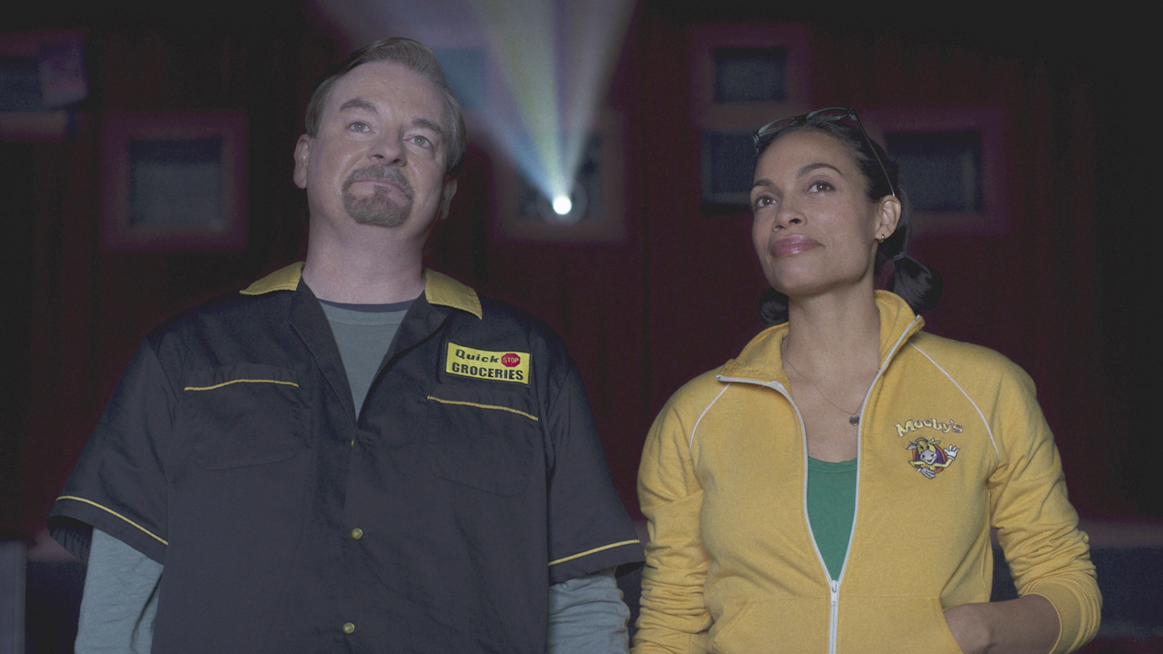 Brian O'Halloran and Rosario Dawson holding hands at the movies in Clerks III.