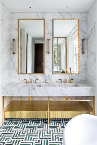 Double vanity with mirrors above and geometric floor tile