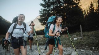 Writer Sam and group hiking French Alps, smiling at camera during walk