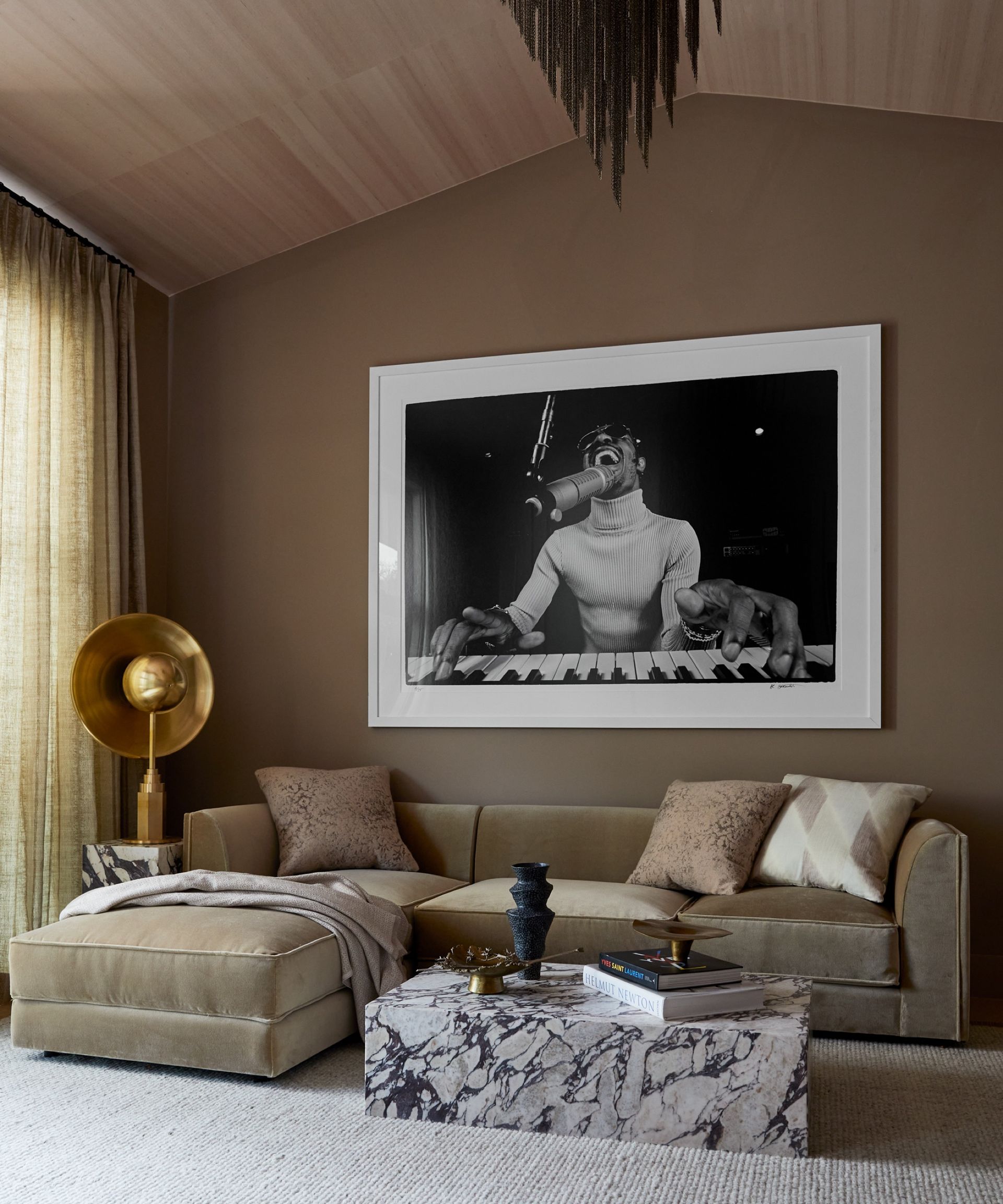 beige living room with beige sofa by K Interiors