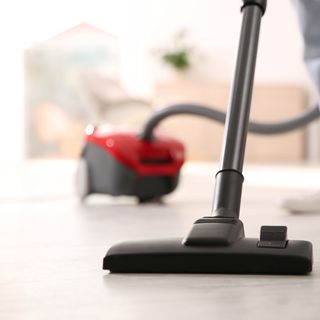 Vacuum cleaning white floor