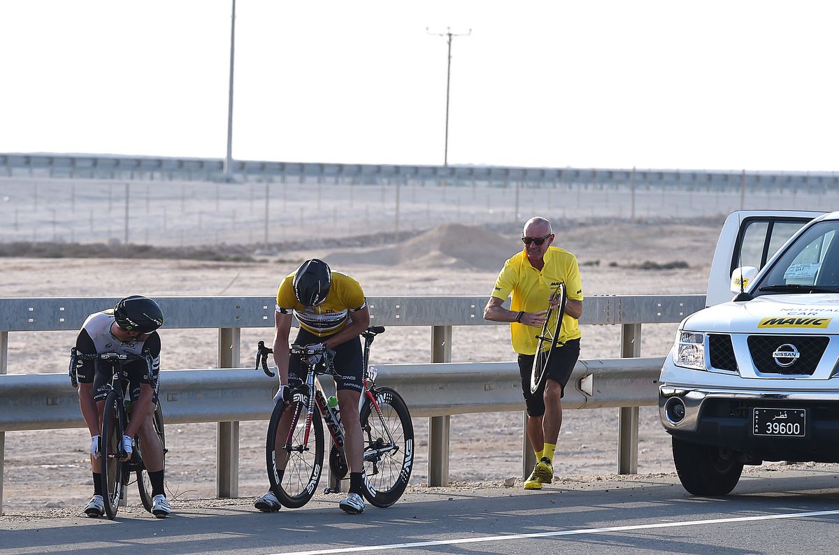 Edvald Boasson Hagen tries to get his front wheel out as quick as possible after puncturing