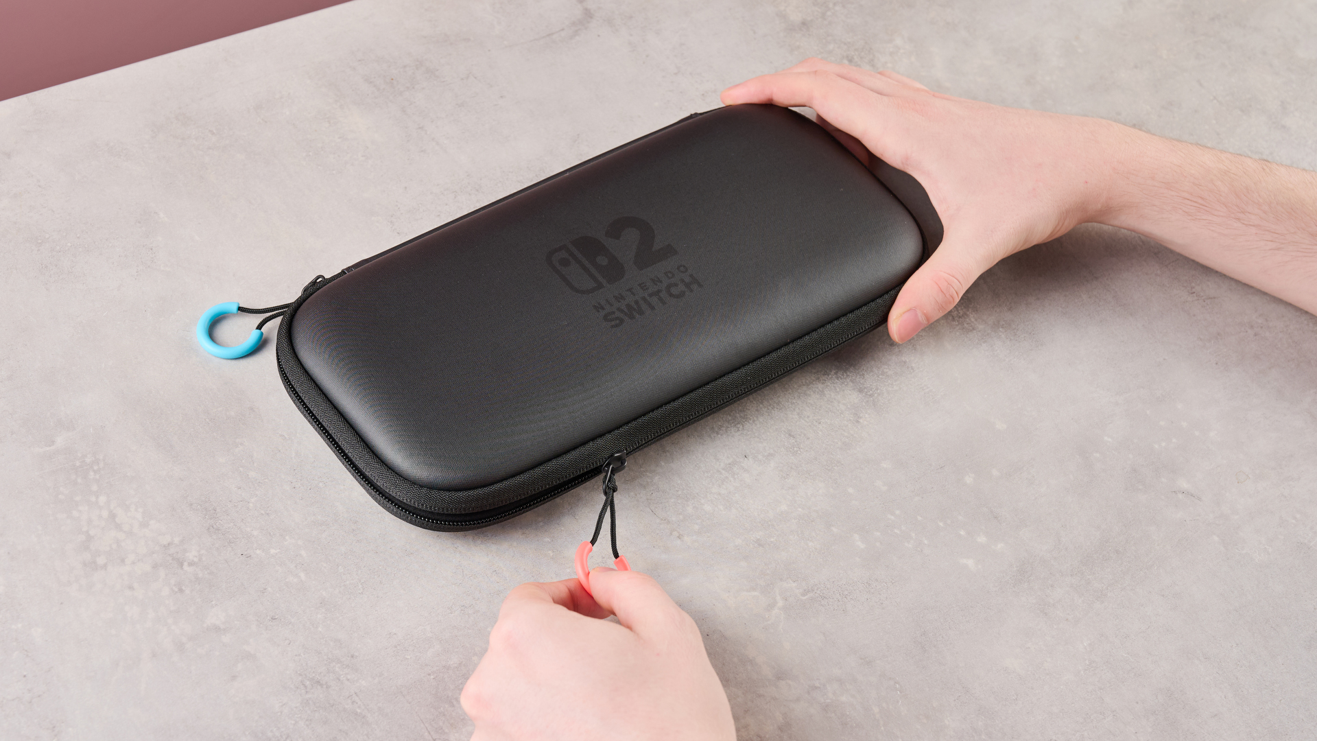 Person closing the Nintendo Switch 2 Carrying Case