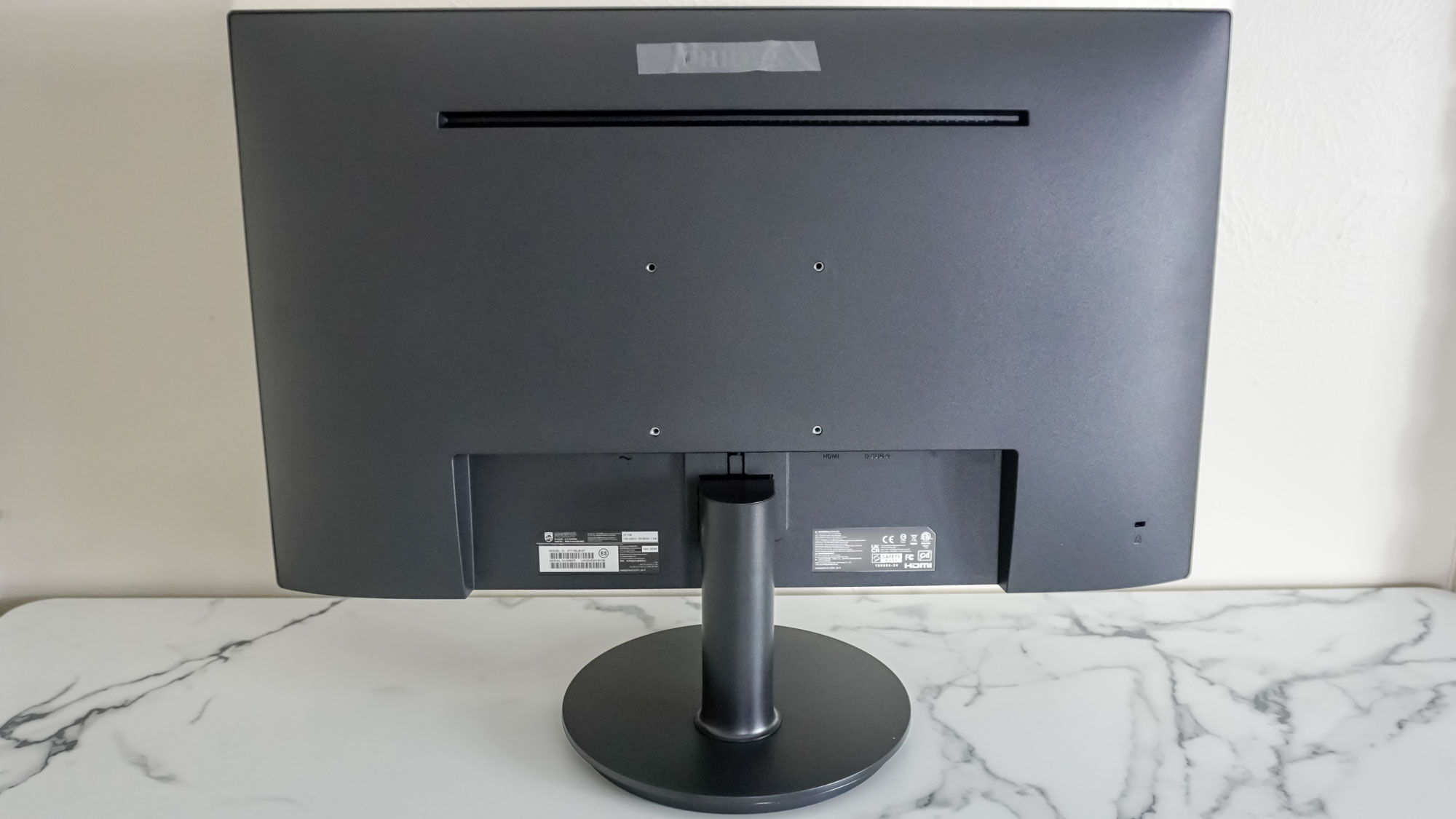 The back of a Philips V8 Series monitor showing the included stand and 100 x 100 VESA mounting holes