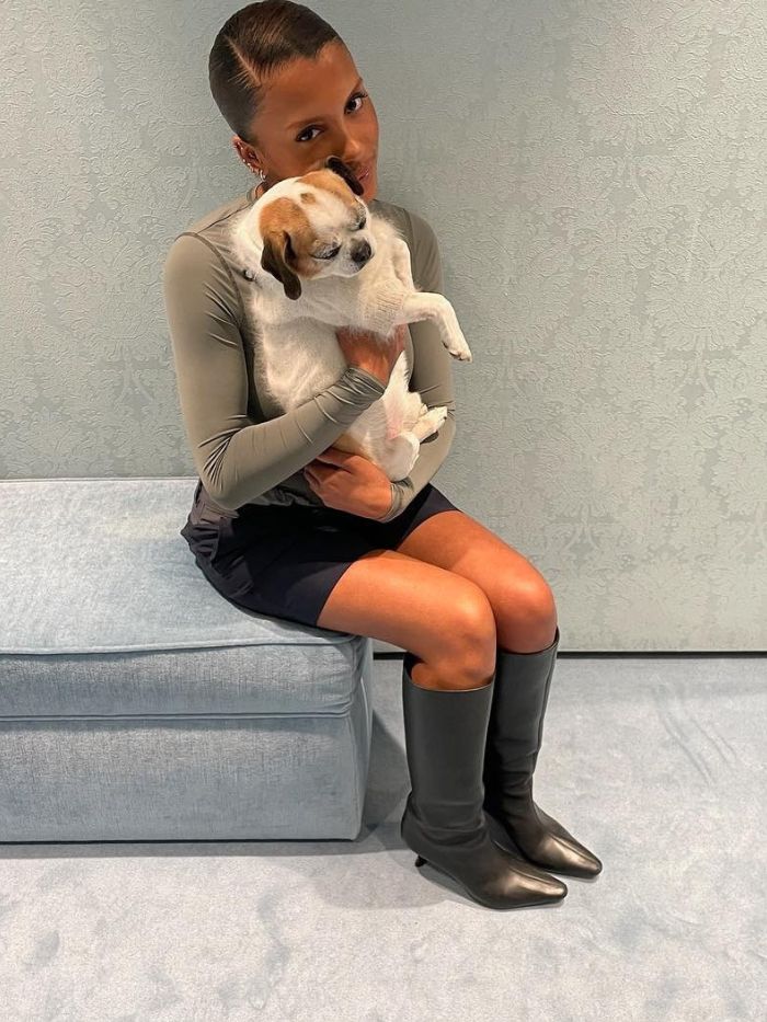 Creator @mv.tiangue with a slicked-back, statement side part hairstyle