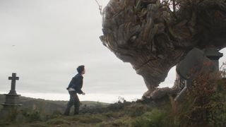 Lewis MacDougall yells at the monster at a graveyard in A Monster Calls