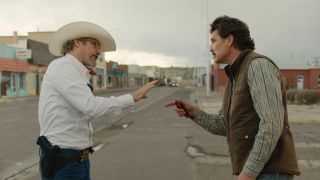 Joaquin Phoenix and Pedro Pascal in a faceoff in Eddington