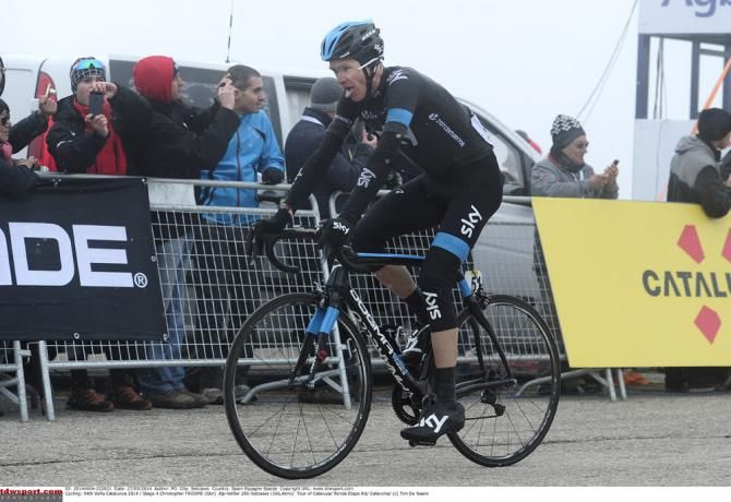 Chris Froome (Sky) at the Vallter 2000 finish line amidst fog and snow.
