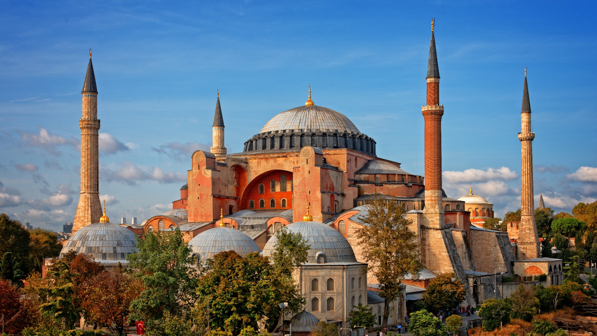 Hagia Sophia (Ayasofya), a large domed monument surrounded by 4 tall, pointy towers in Istanbul, Turkey.