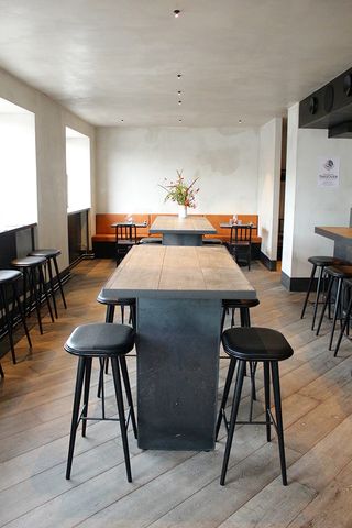 Restaurant with table and bar stools