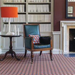 room with bookshelves and arm chair