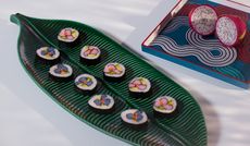 Sushi on a green ceramic leaf shaped plate