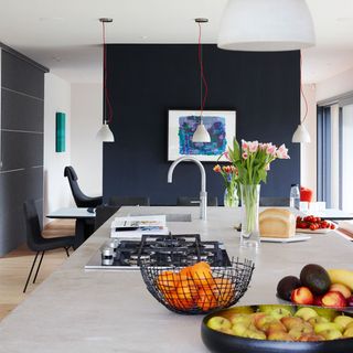 kitchen with wooden floor and fruits on counter