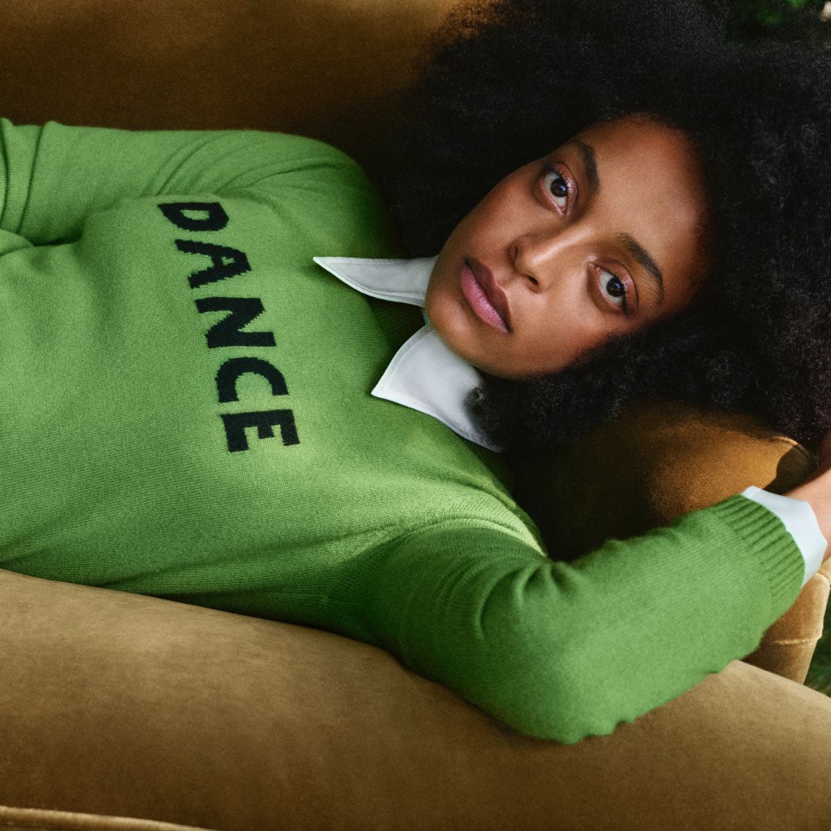 a model wears a green dance jumper from the bella freud M&amp;S collection