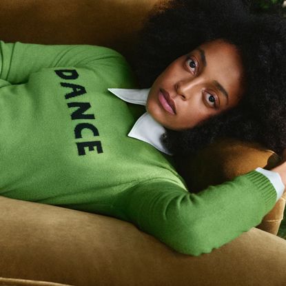 a model wears a green dance jumper from the bella freud M&S collection