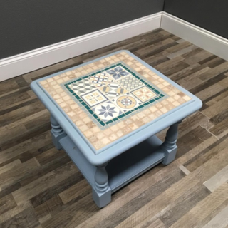 mosaic table on wooden floor