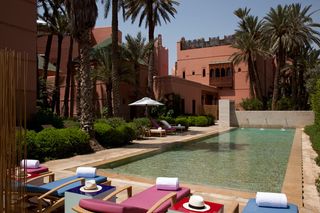 swimming pool with lounge chairs