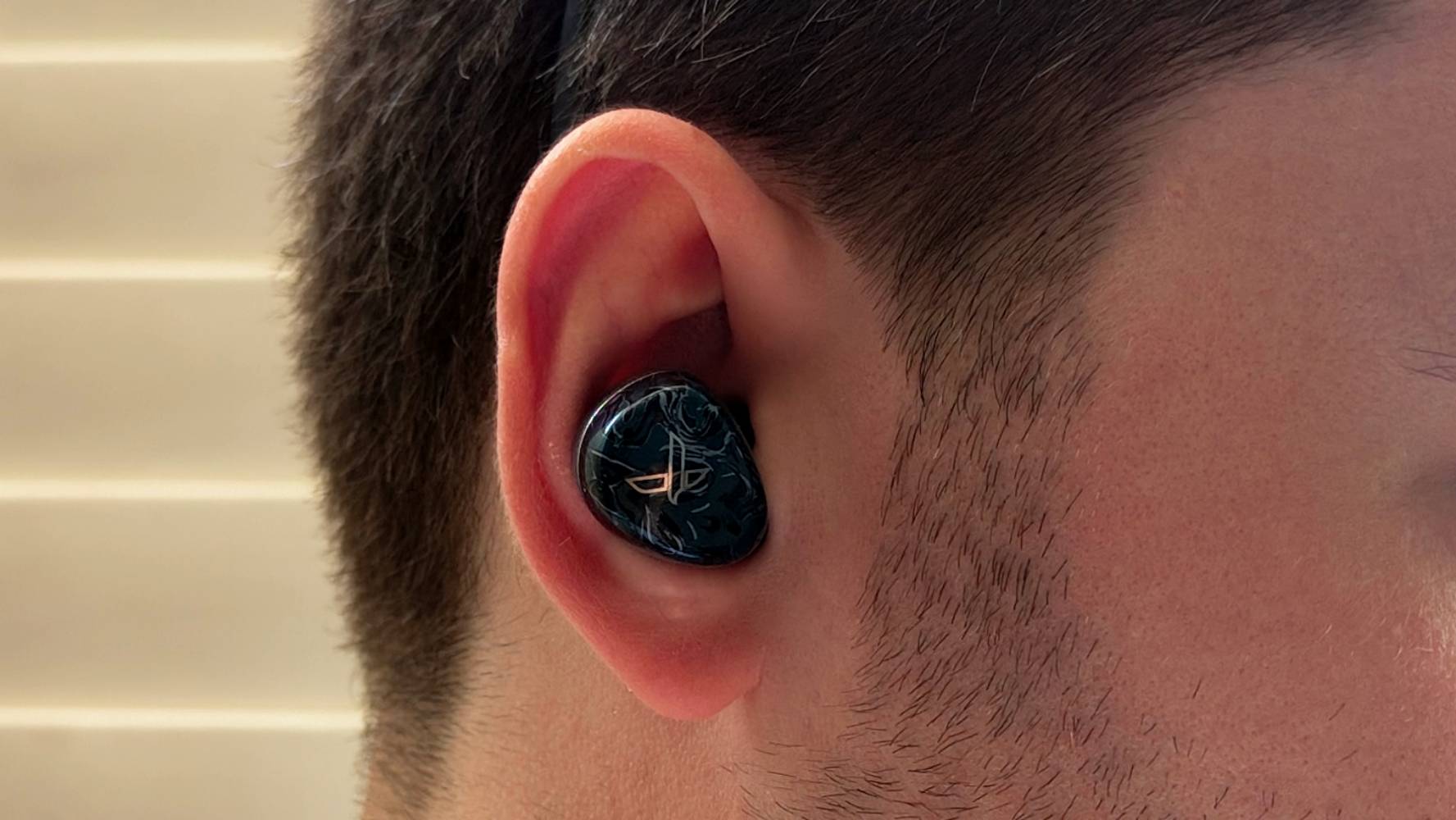 The Noble Osprey in a man's ear.