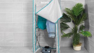 Beldray heated clothes airer next to plant