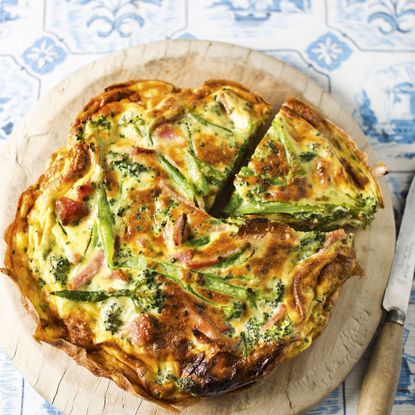 Broccoli and Bacon Frittata served on a wooden board